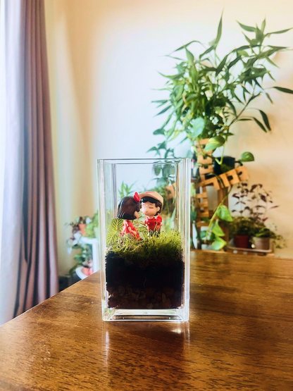 Mini moss terrarium birthday gift in Dubai with cute love figurine