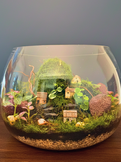 Layered terrarium soil with lava rocks and decorative pebbles for Evergreen Hamlet Terrarium