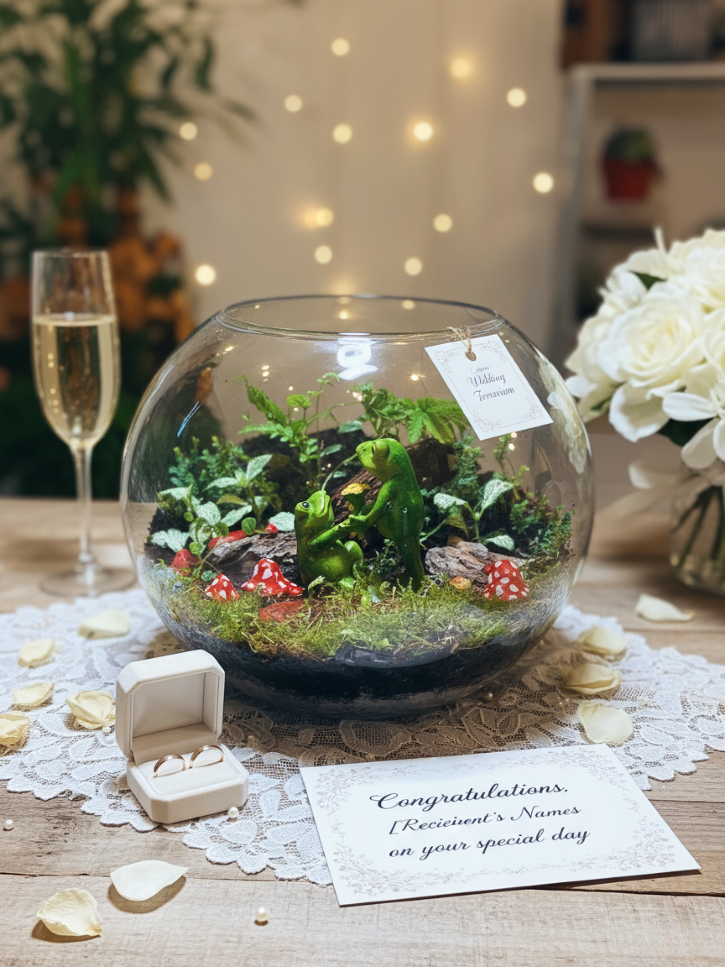 A handcrafted wedding terrarium created by Lilli Plants, showcasing premium Fittonia, ferns, moss, and a loving couple frog centerpiece. One of the best terrariums in Dubai, perfect for luxury gifting and indoor transformations.
