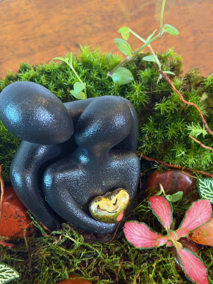 Elegant love terrarium with couple centerpiece, spider wood and lush moss by Lilli Plants Dubai