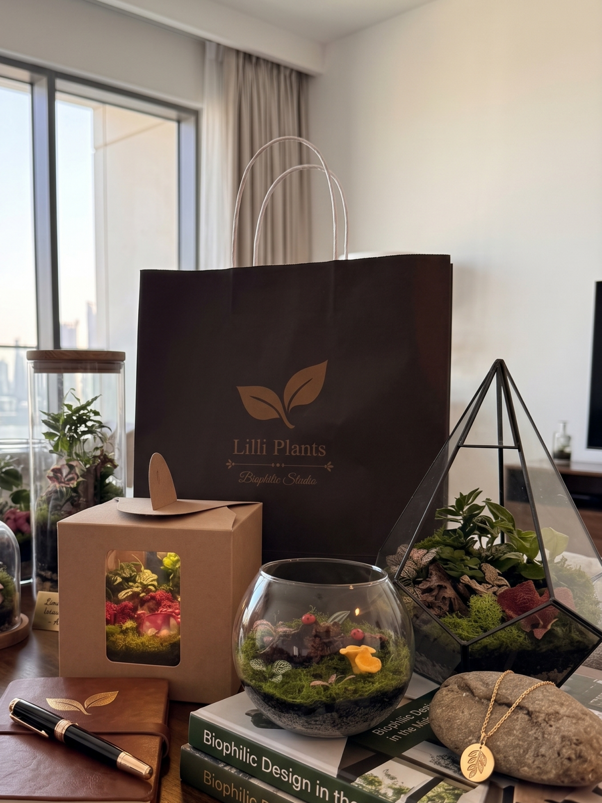 Handcrafted bioactive glass terrarium displayed as an eco-friendly corporate gift in a modern Dubai office setting.