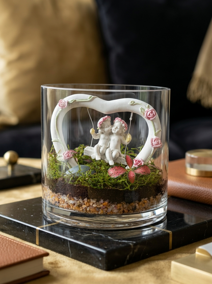 Top view of Love Nest Mini Cylinder Terrarium with lush flat moss, Fittonia Red, and heart swing – premium romantic gift Dubai