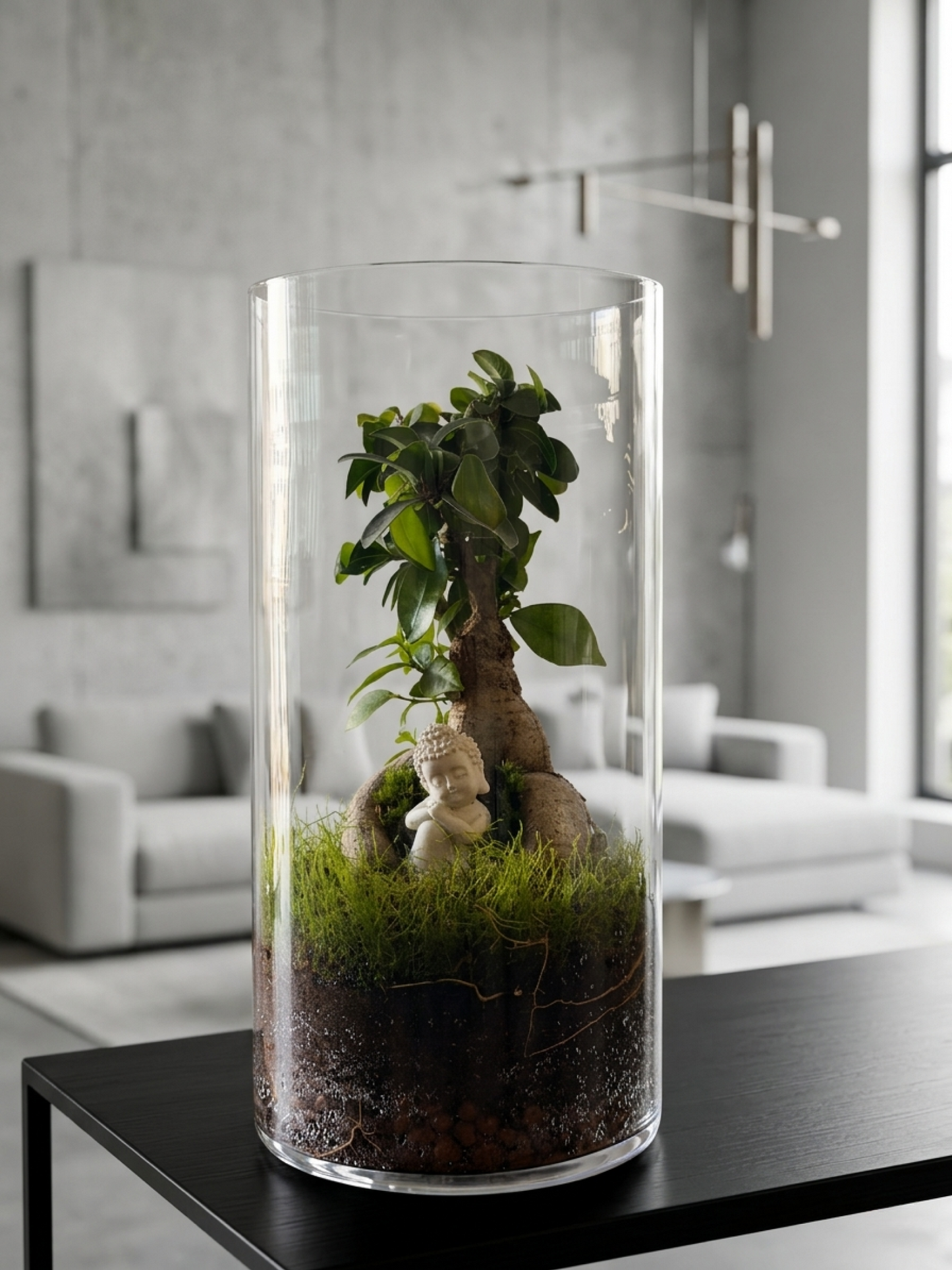 Elegant Ficus Microcarpa terrarium showcasing a peaceful Buddha beneath a bonsai canopy in a tall glass cylinder.
